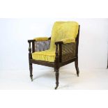 George III Style Mahogany Bergere Library Chair, with upholstered padded arms and cushion seat and