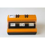Mid 20th century Retro Orange and Black Plastic Perpetual Desk Calendar, 11cms long