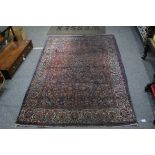 Red Ground Wool Rug, 209cms x 134cms