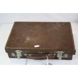 A vintage attache case containing playing cards, brass door knobs, portrait miniature etc.