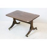 Regency Style Mahogany Coffee Table raised on reeded splayed legs terminating in brass paw feet