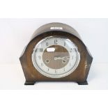 An oak cased mid 20th century mantel clock with two train movement.