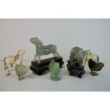 Two Early 20th century Chinese / Japanese Carved Ivory Horses together with Five Jade? / Green Stone