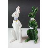 Two Early 20th century Pottery Models of Seated Hares, one white glazed and the other green
