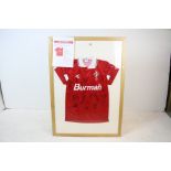 A glazed and framed 1993-95 Swindon Town football club shirt with various signatures of players.