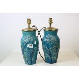 Pair of Chinese ? Pottery Peacock Blue Glazed Vases with peacock relief decoration, converted to