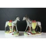 Pair of Staffordshire Pottery Donkeys carrying baskets of fruit