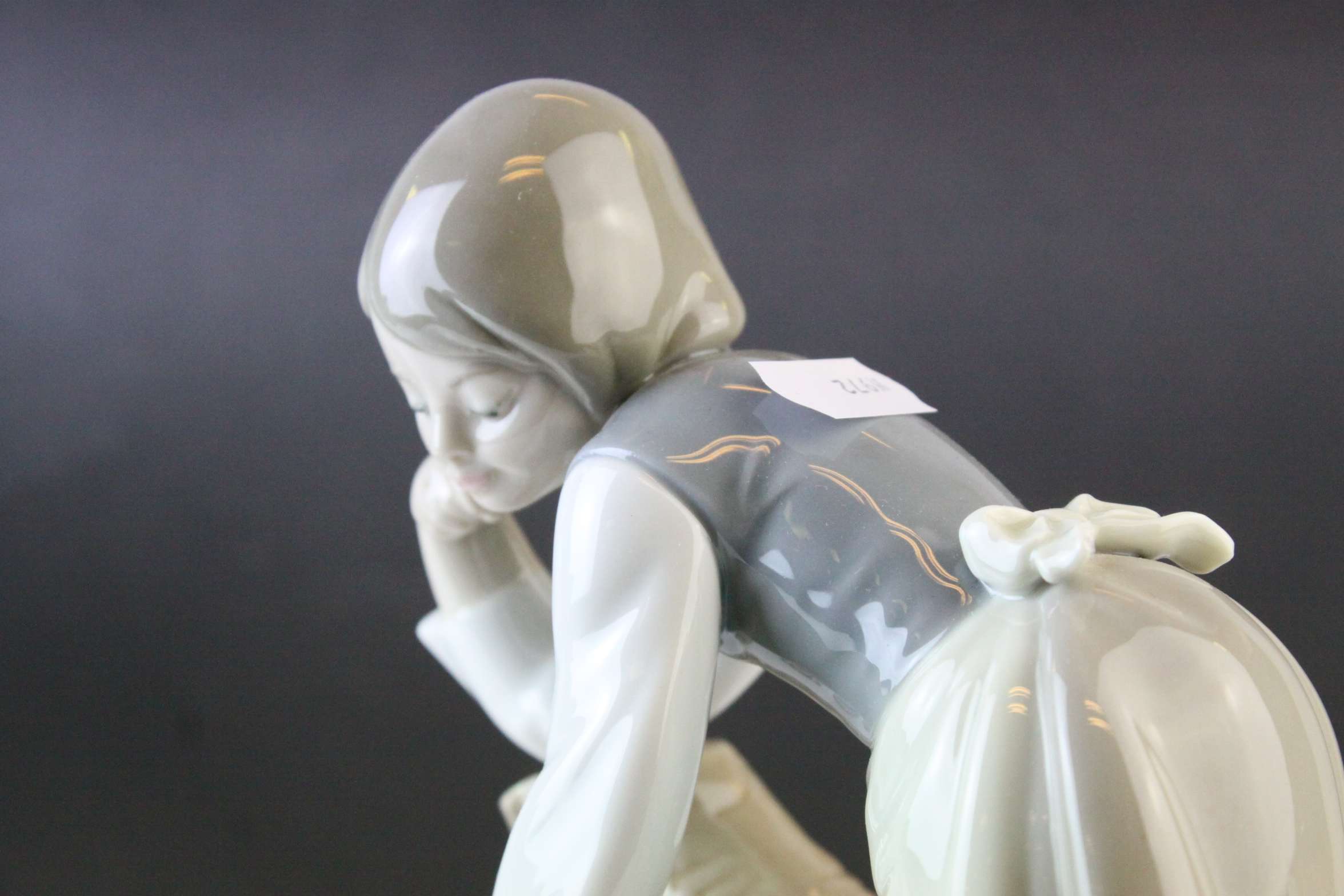 Two Lladro Figures, Caress and Rest, model no. 1245, 21cms high and a Seated Girl holding Flower - Image 9 of 10