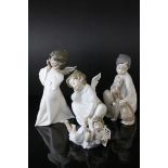 Four Lladro Figures including ' Shh Quiet Puppy ' model no. 4522 and Three Angel Figures
