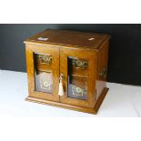 Late 19th century Oak Table Top Cabinet, the two glazed doors opening to reveal drawers with brass