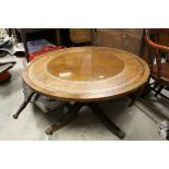 Low Mahogany Circular Centre Table with Brown Leather Inset Top raised on a pedestal base with
