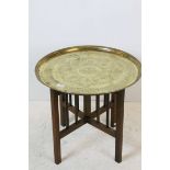 Middle Eastern Folding Table with brass top Table and folding wooden base, 57cms wide x 51cms high