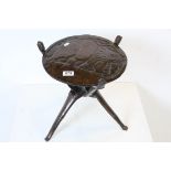 African Tribal Hardwood Table, the lift off top carved with an elephant, the folding base carved