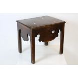 George III Mahogany Stool, the hinged lid opening to reveal a storage compartment, with shaped apron