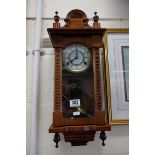 A mahogany cased vienna style wall clock with two train movement .