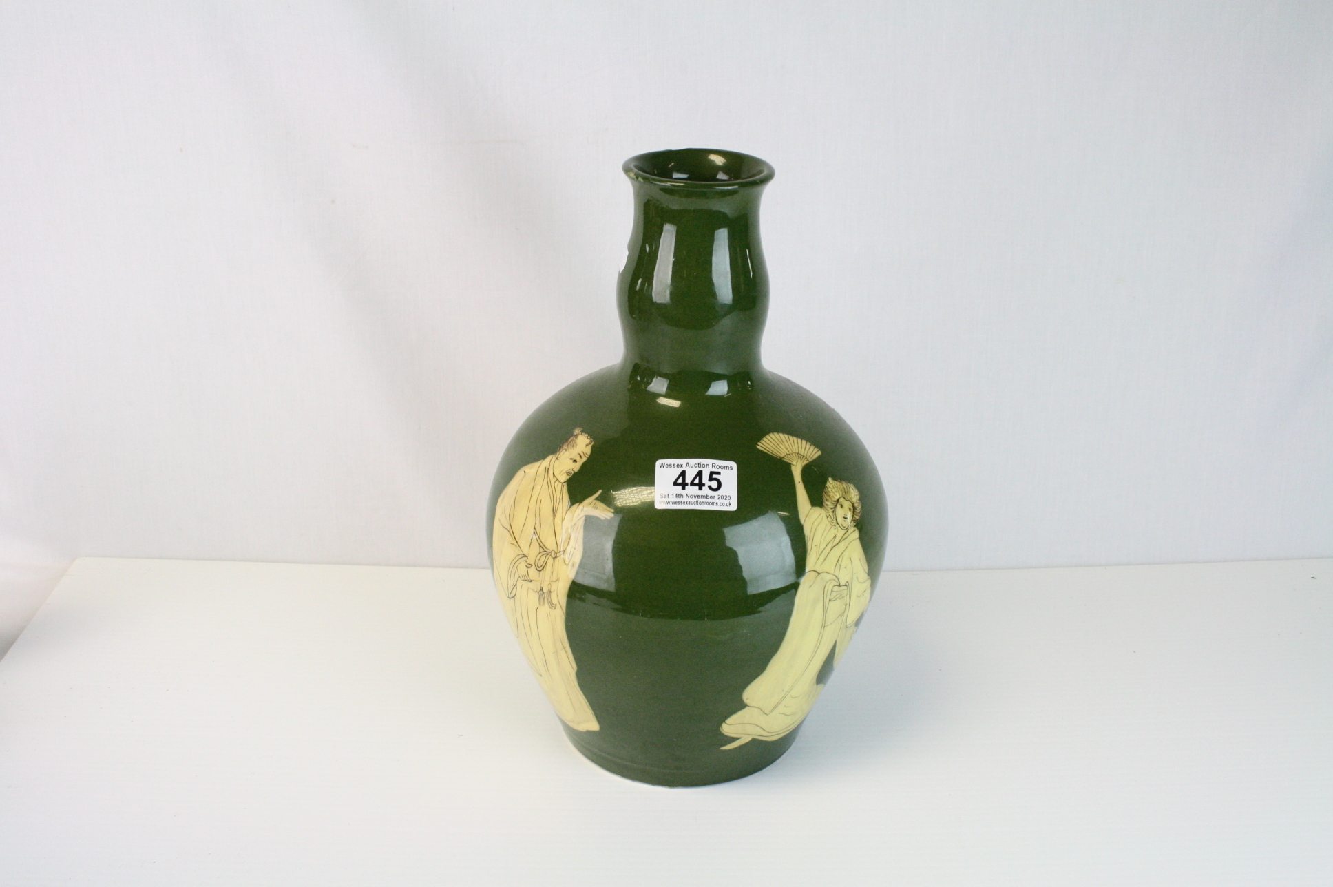 An early 20th century green ground Art Nouveau Vase decorated with Oriental figures inscribed mark