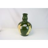 An early 20th century green ground Art Nouveau Vase decorated with Oriental figures inscribed mark