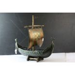 Bronzed Metal Model of a Viking Boat on a Wooden Stand with makers mark for E Aagaard inc on rudder