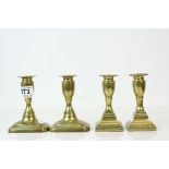 Pair of Brass Antique Ejector Candlesticks together with one other pair