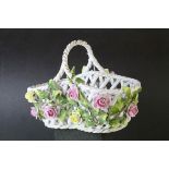 German Von Schierholz Porcelain Pierced Basket decorated with encrusted flowers, 21cms long