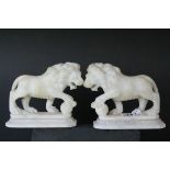 Pair of Carved Alabaster Lions holding a Ball under their front paw, 15cms long