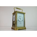 French Gilt Brass Carriage Clock, the white enamel face with Roman numerals and marked A.1, The