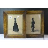 A pair of 19th century framed Silhouette portraits of a man and women in costume. 24 x 18 cm.
