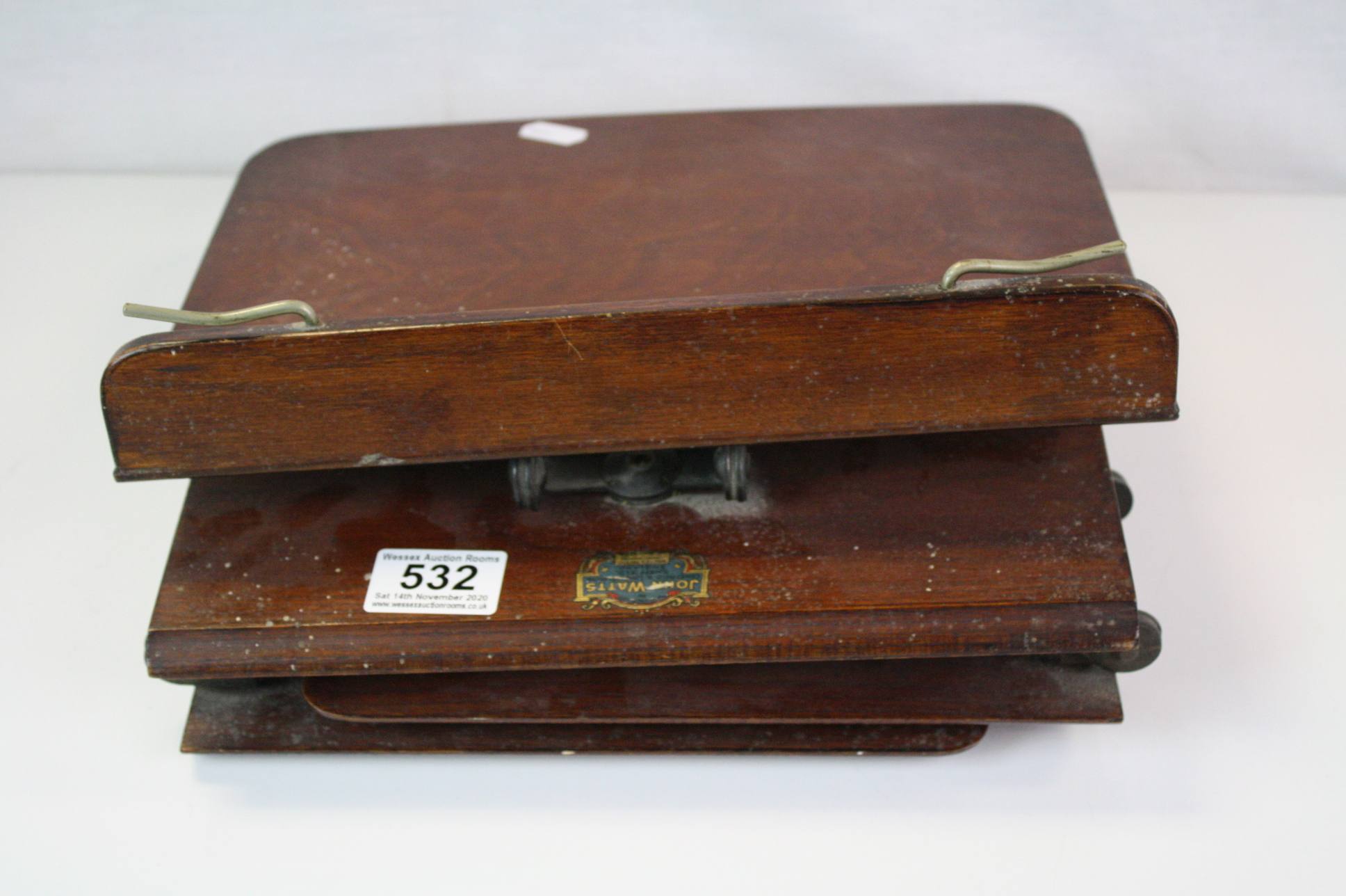 A vintage folding book rest a novelty box in the form of a book and a pair of brass candle sticks. - Image 5 of 7