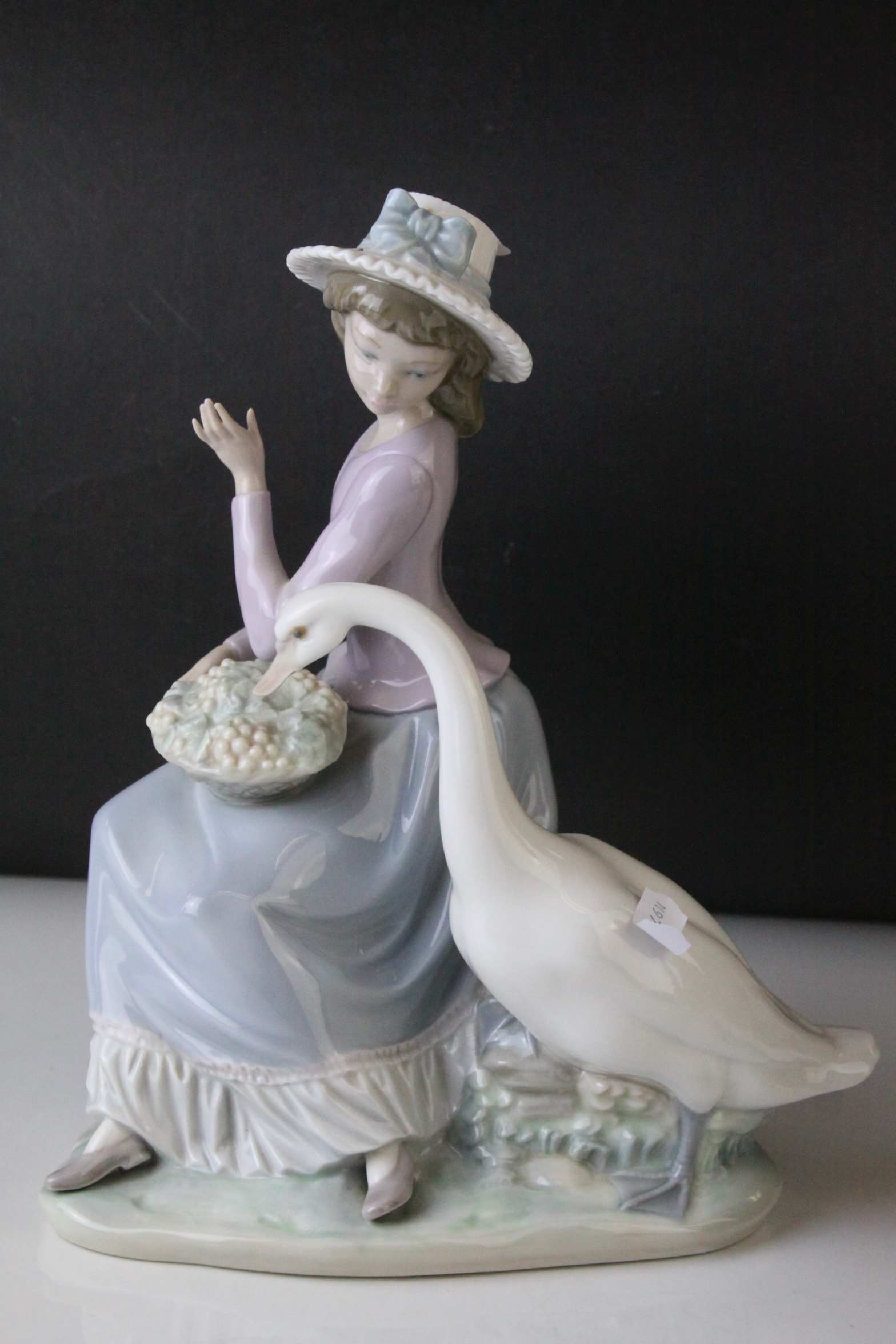 Two Lladro Figures, Caress and Rest, model no. 1245, 21cms high and a Seated Girl holding Flower - Image 2 of 10