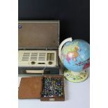 A vintage tinplate globe a quantity of marbles, moneybox and a cased Vidor radio.