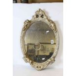 Oval Mirror in ornate gesso frame with cherubs, 64.5cms x 41.5cms