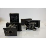 Two early 1900's Kodak vest pocket cameras, one in leather case, the other with original box