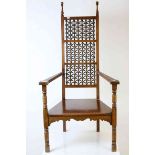 In the manner of Liberty & Co and Leonard Wyburd, Moorish Style Hardwood Low Elbow Chair, the back