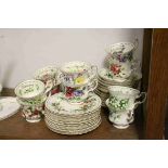 Set of Twelve Royal Albert ' Flowers of the Month Series ' Cups, Saucers and Tea Plates, one set for