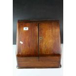 Victorian Oak Stationery Cabinet, the sloping front with two doors opening to reveal a fitted