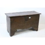 Small 17th century or Later Oak Six Plank Coffer, with light carving to front panel and a shaped
