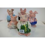 Five Nat West pig money banks, all with stoppers