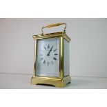 Late 19th / Early 20th century Gilt Brass Carriage Clock, the white enamel face with Roman