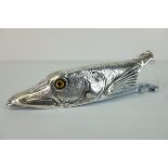 A novelty paper holder in the form of a pike fish.