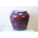 Large Chinese Ceramic Jardiniere decorated with Five Toed Dragons on a Red Ground, 39cms high