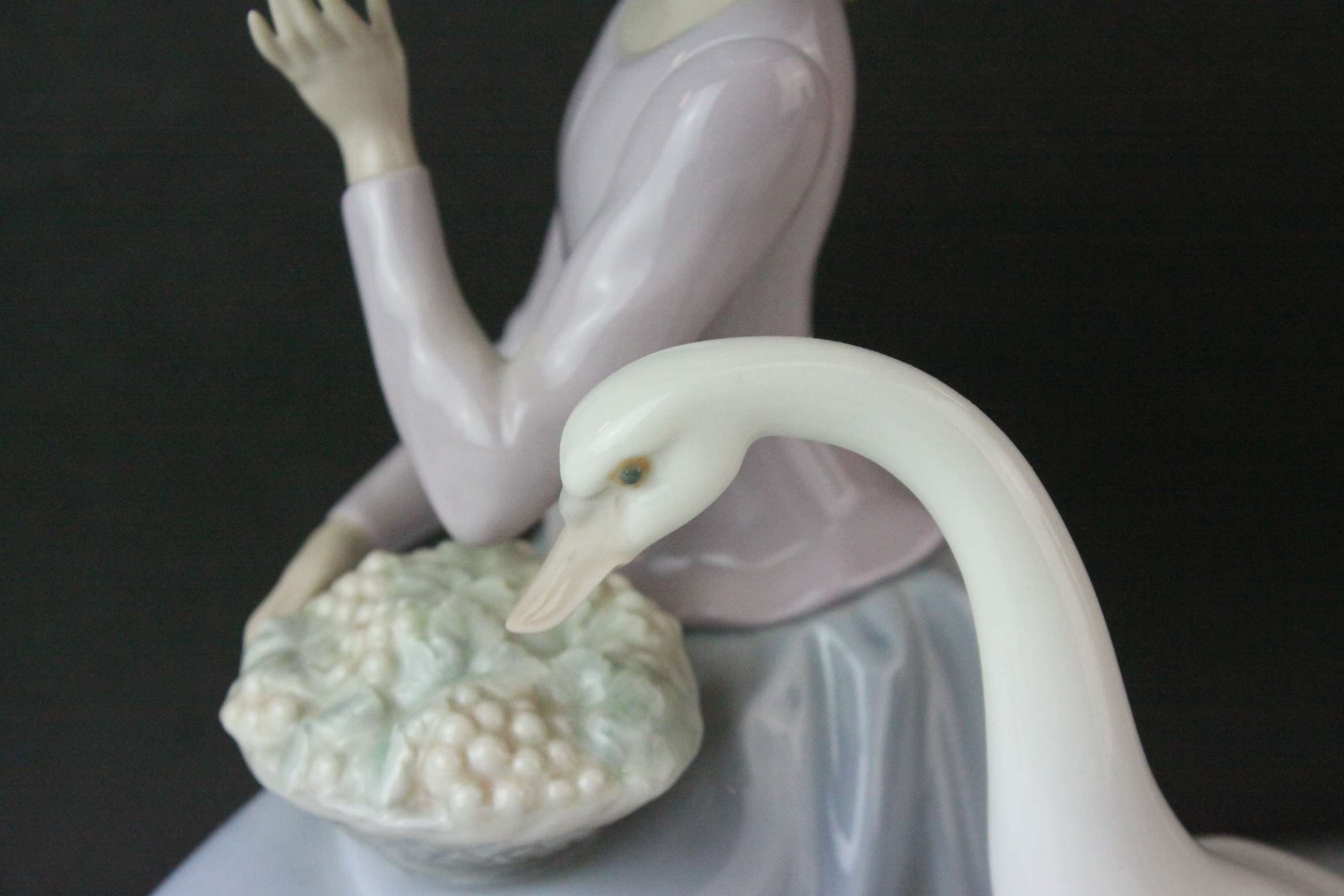 Two Lladro Figures, Caress and Rest, model no. 1245, 21cms high and a Seated Girl holding Flower - Image 3 of 10