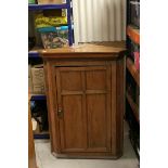 19th century Hanging Corner Cabinet, the single panel door opening to reveal two shelves, 109cms