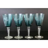 Set of Four Blue Wine Goblets, etched with grapes and vines, raised on clear air twist stems,