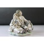 Lladro Figure Group of a Seated Boy and Girl with Puppy, 15cms high