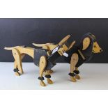 Two Wooden Cut-Out Articulated Dog Toys, approx. 31cms long