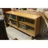 Mid 20th century Pale Oak Bookcase with four glass sliding doors, 153cms long x 74cms high