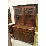 George III Style Mahogany Bookcase, the upper section with twin astragel glazed doors opening to