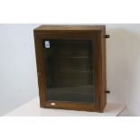 Early to Mid 20th century Oak Hanging Display Cabinet, the single glazed door opening to reveal four