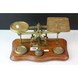 Late 19th / Early 20th century Set of Brass Postal Scales with Six Weights, on wooden base, 20cms