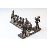 Benin Bronze Style Sculpture of a Slave Trader with Slaves, 19cms long